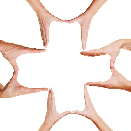 Many hands forming a medical cross symbol for health and pharmacyの写真素材