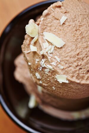 Scoop of homemade mocha ice cream with white chocolate