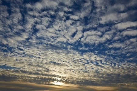 Beautiful sunset with many clouds in the blue sky