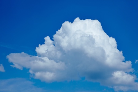 Single big white cloud in a blue sky
