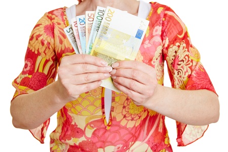 Female hands holding different Euro money banknotesの写真素材