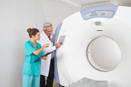 Doctor explaining MRI to MTA nurse in a hospital