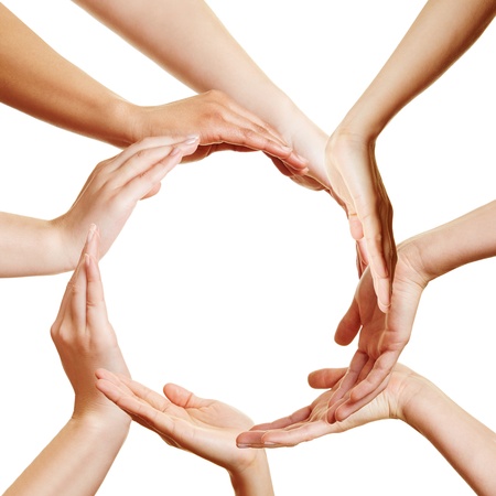 Team of many hands forming a circle