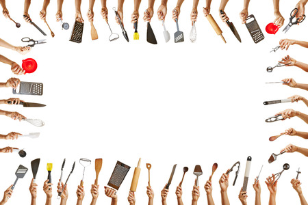 Frame with many hands holding different kitchen tools for gastronomyの写真素材