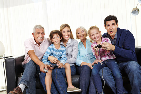 Family playing video game together on Smart TV in living room