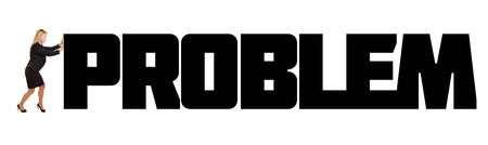 Business woman pushing a big problem to the sideの写真素材