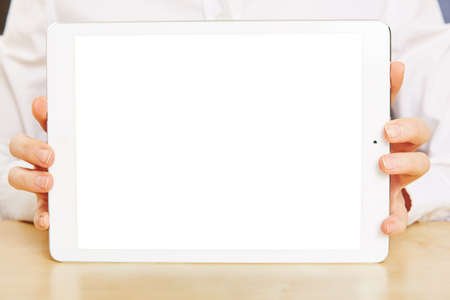 female hands holding white tablet computer with empty touchscreenの写真素材