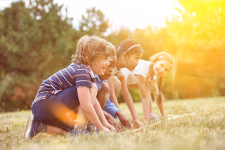 Children at the start of a race getting readyの写真素材