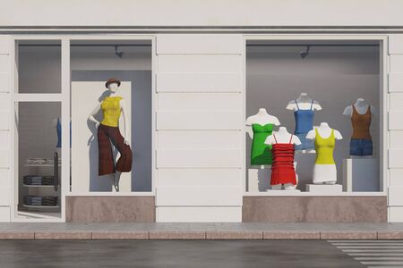 Shop window of a fashion store with mannequins and clothesの写真素材