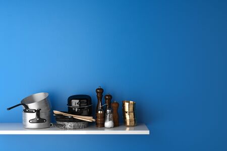 Household goods and kitchenware on shelf in kitchen in front of a blue wall (3D Rendering)の写真素材