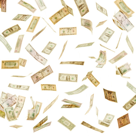 Many different dollar bills flying in the airの写真素材