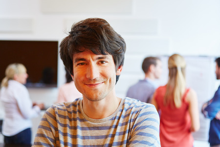 Young man as businessman happy about his start-up company