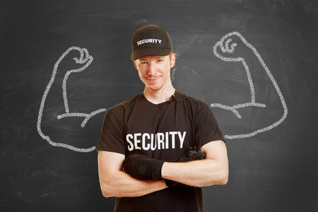 Strong and self confident security man with muscles made of chalkの写真素材