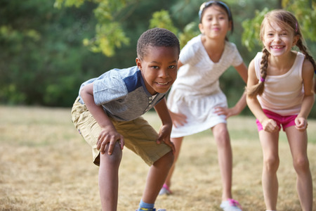 Interracial group of kids in summer having funの写真素材