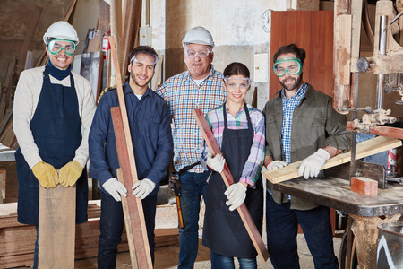 Craftsmans team standing together looking content