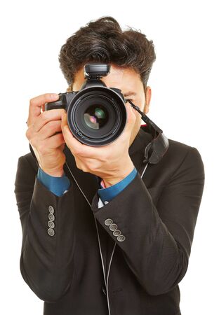 Business man taking photos with modern digital DSLR cameraの写真素材
