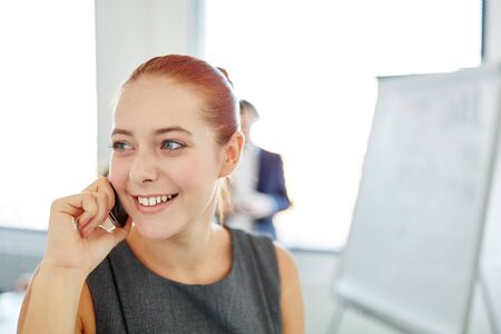 Businesswoman with smartphone  in start-upの写真素材