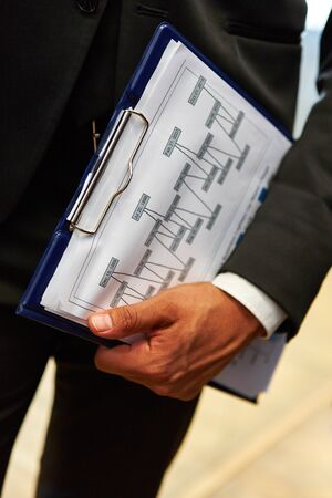 Graph on clipboard at business consulting meeting for organizationの写真素材