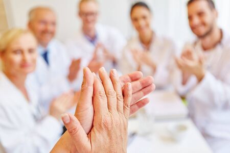 Doctors clapping hands and applauding on consentの写真素材