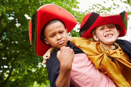 Interracial friends in carnival with costumes