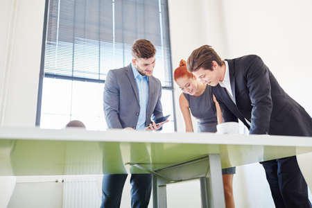 Business people brainstorming in meeting as a team and planning
