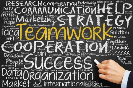 Teamwork concept on blackboard with many business conceptsの写真素材