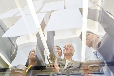 Start-up team brainstorming in workshop and working togetherの写真素材