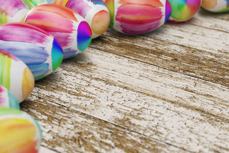 Colorful easter eggs laying on old wood (3D Rendering)の写真素材