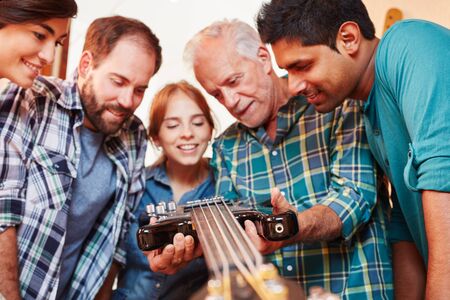 Group of apprentices with artisan learn all about craftsmanshipの写真素材
