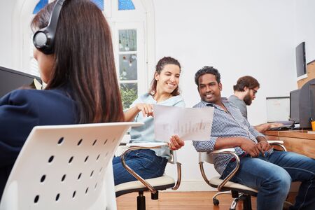 Collegues in customer service call center as consultants