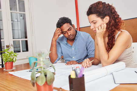 Colleagues brainstorming and thinking about financial analysis