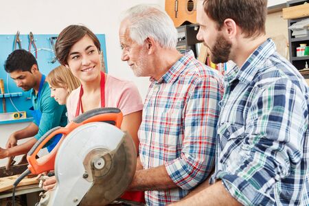 Apprentices and craftsman as instructor working togetherの写真素材