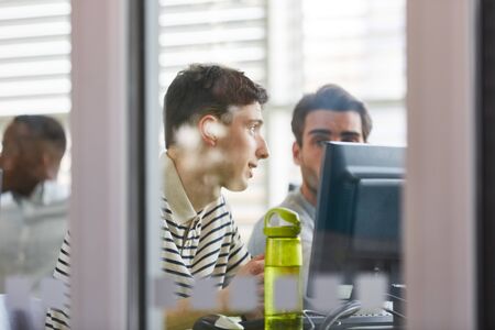 Two students learn IT in computer course at the uniの写真素材