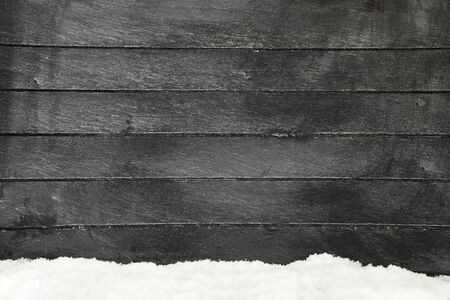 Gray wood background with snow in winter for copy spaceの写真素材