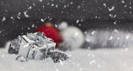 Christmas gift as winter background with snow and decorationの写真素材