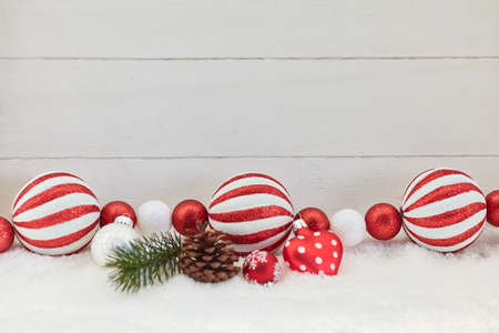 White and red christmas decoration with wooden backgroundの写真素材