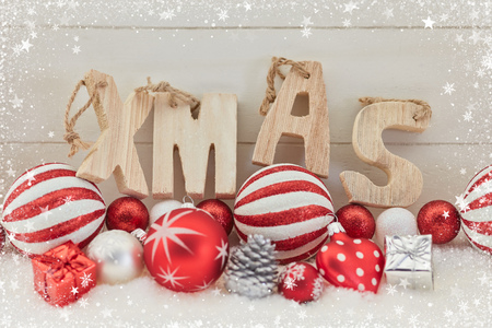 Xmas wooden text on christmas decoration as greeting cardの写真素材