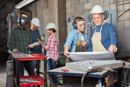 Metalworking workers planning in teamworkの写真素材
