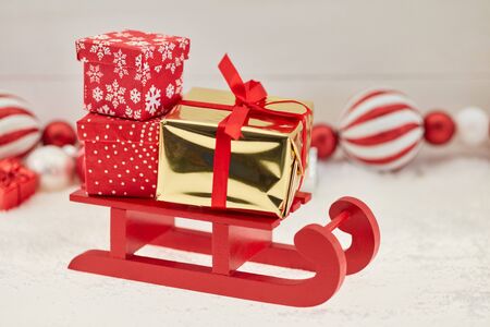 Christmas presents delivery or shipping concept with sled 