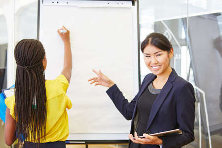 Businesswomen in consulting presentation showing business solution ideasの写真素材