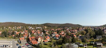 Many houses in Wernigerode as a panorama with a blue skyの写真素材