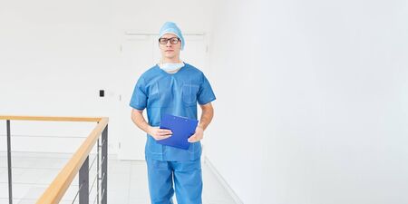 Emergeny service surgeon doctor walk on hospital hallwayの写真素材