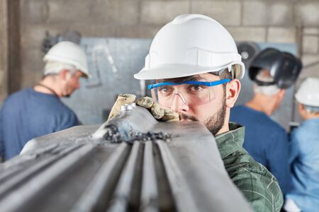 Worker makes production quality control in metallurgy factoryの写真素材