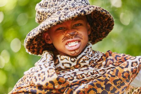 African child with creative leopard costume and face paintの写真素材