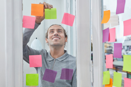 Young student in business start-up is excited about creative brainstorming ideasの写真素材