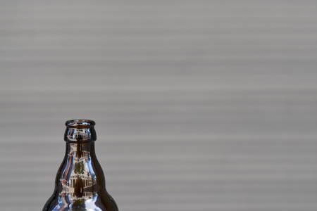 Bottle of glass beer against a calm background