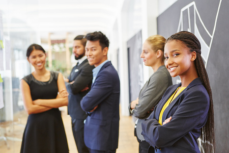 Start-up team standing proud in interracial company