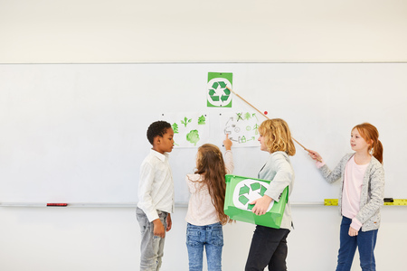 Children in elementary school give a presentation on a conservation projectの写真素材