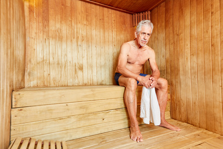 Senior man in the sauna sweats for health at the Wellness Hotelの写真素材
