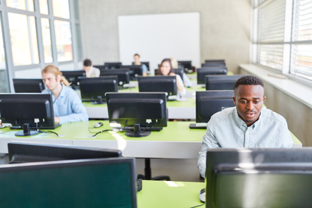 Group of students in e-learning seminar in computer roomの写真素材
